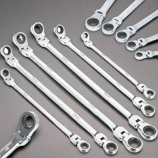 Set of silver ratcheting wrenches on a white background